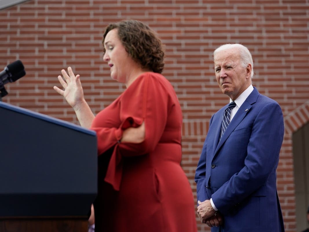 President Joe Biden listens as Rep. Katie Porter, D-Calif., speaks at Irvine Valley Community College, in Irvine, Calif., Friday, Oct. 14, 2022.